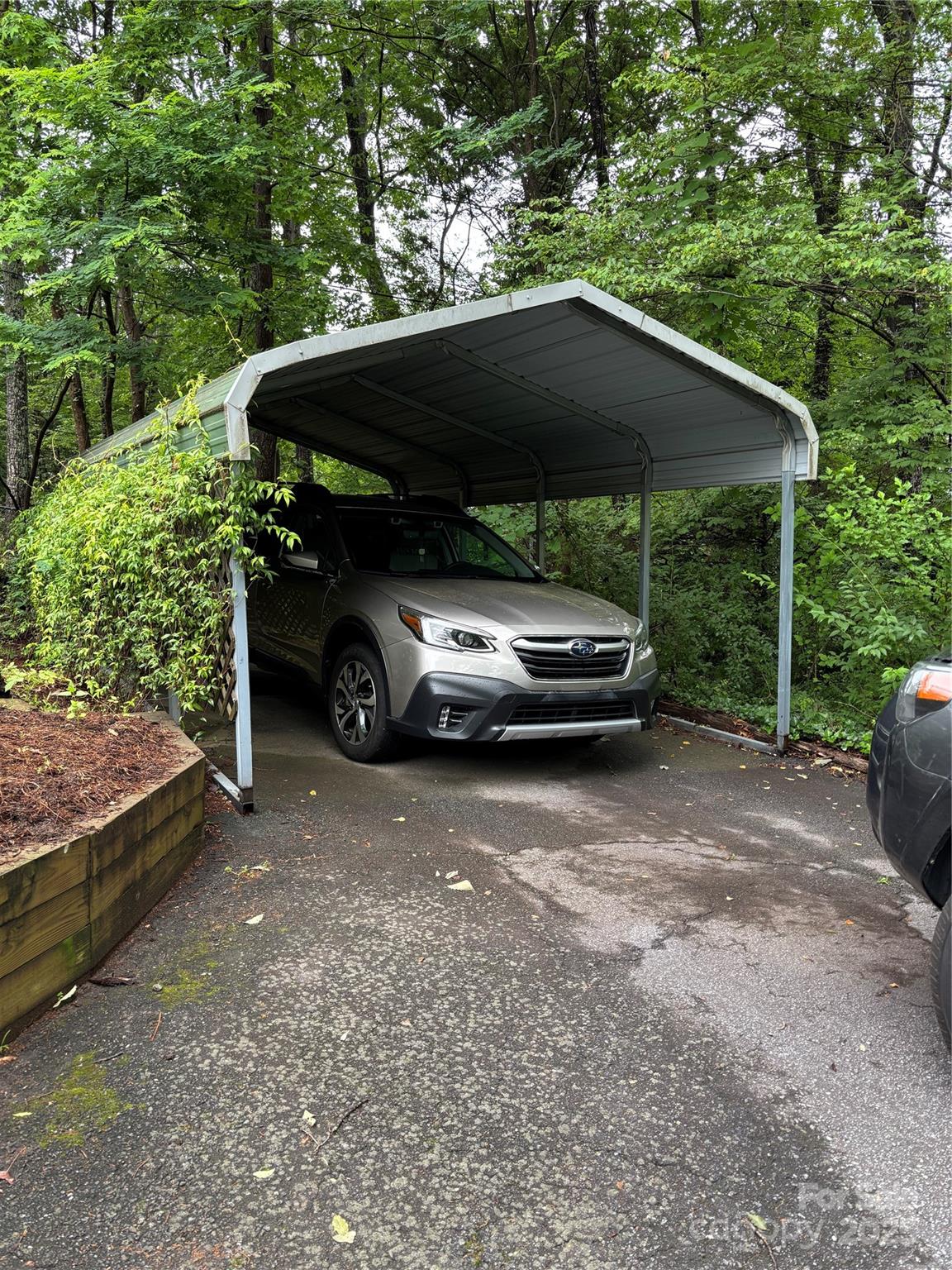 160 Hidden Hill Road Tryon, NC 28782 - Photo 42 of 47 a car parked in front of a house