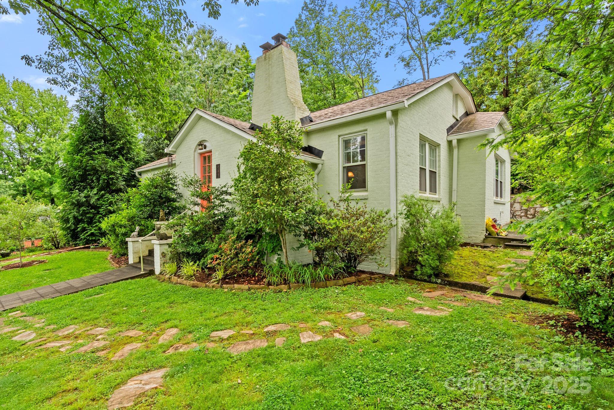 160 Hidden Hill Road Tryon, NC 28782 - Photo 5 of 47 a view of a house with backyard and garden