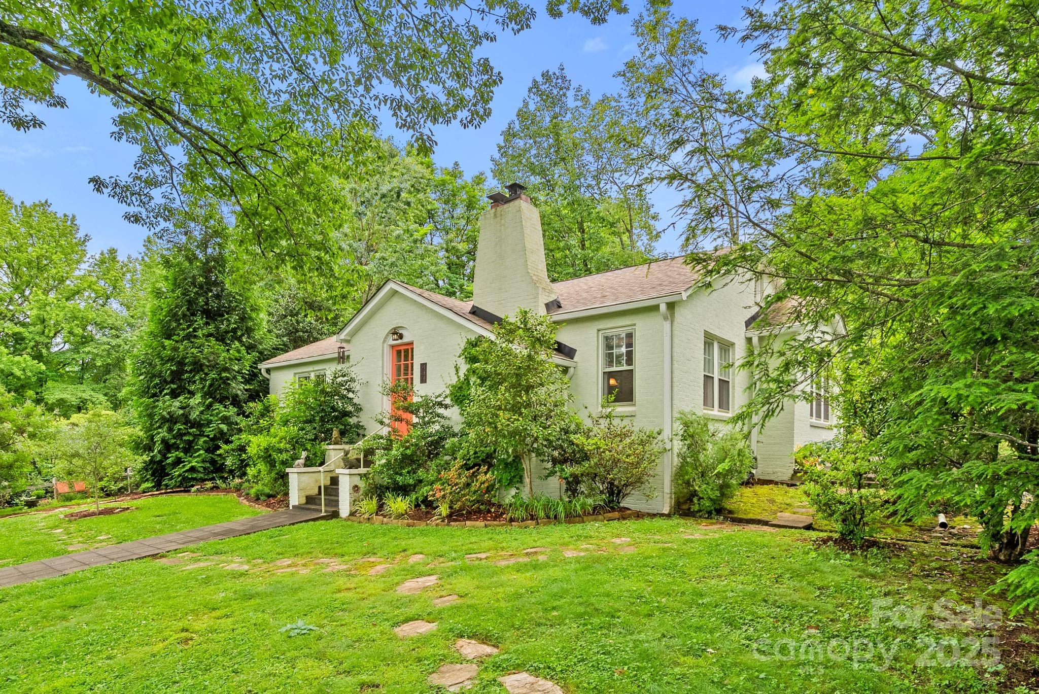 160 Hidden Hill Road Tryon, NC 28782 - Photo 6 of 47 a front view of a house with a yard