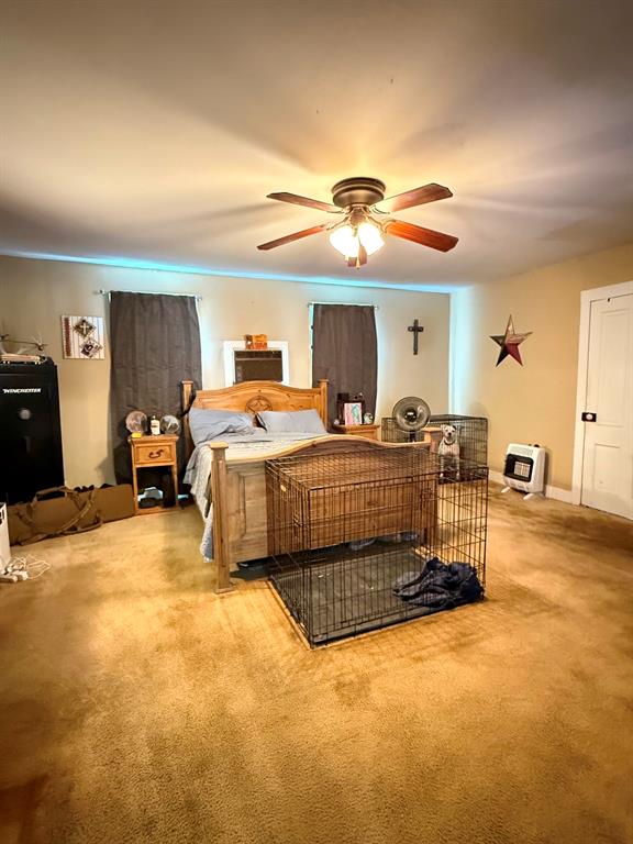 306 3rd Street Valley Mills, TX 76689 - Photo 11 of 14 a bedroom with a bed and a chandelier