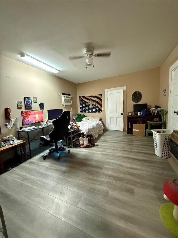 306 3rd Street Valley Mills, TX 76689 - Photo 12 of 14 a bed room with furniture and a flat screen tv