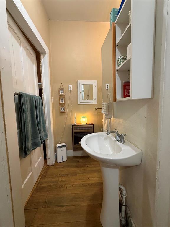 306 3rd Street Valley Mills, TX 76689 - Photo 14 of 14 a bathroom with a sink a mirror and a shower