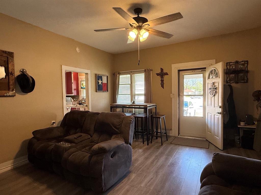 306 3rd Street Valley Mills, TX 76689 - Photo 8 of 14 a living room with furniture and a flat screen tv
