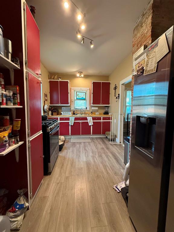 306 3rd Street Valley Mills, TX 76689 - Photo 9 of 14 a view of a kitchen with fridge and workspace