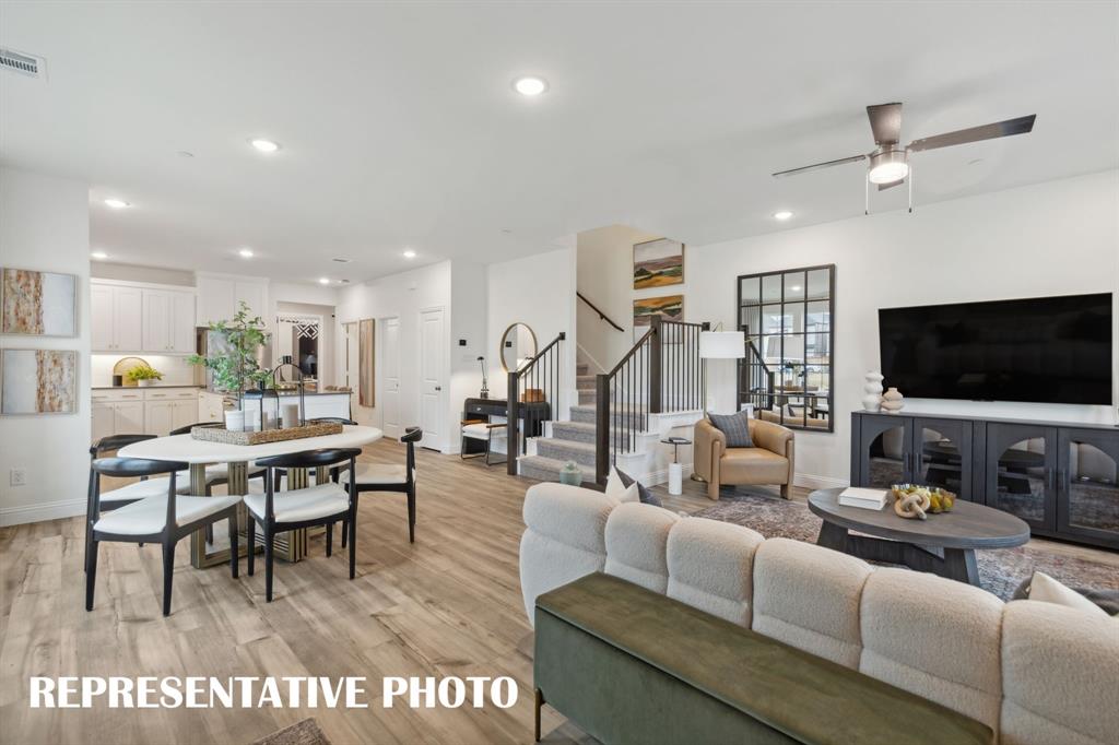 1005 Splitrock Drive Allen, TX 75013 - Photo 2 of 15 a living room with furniture and a flat screen tv
