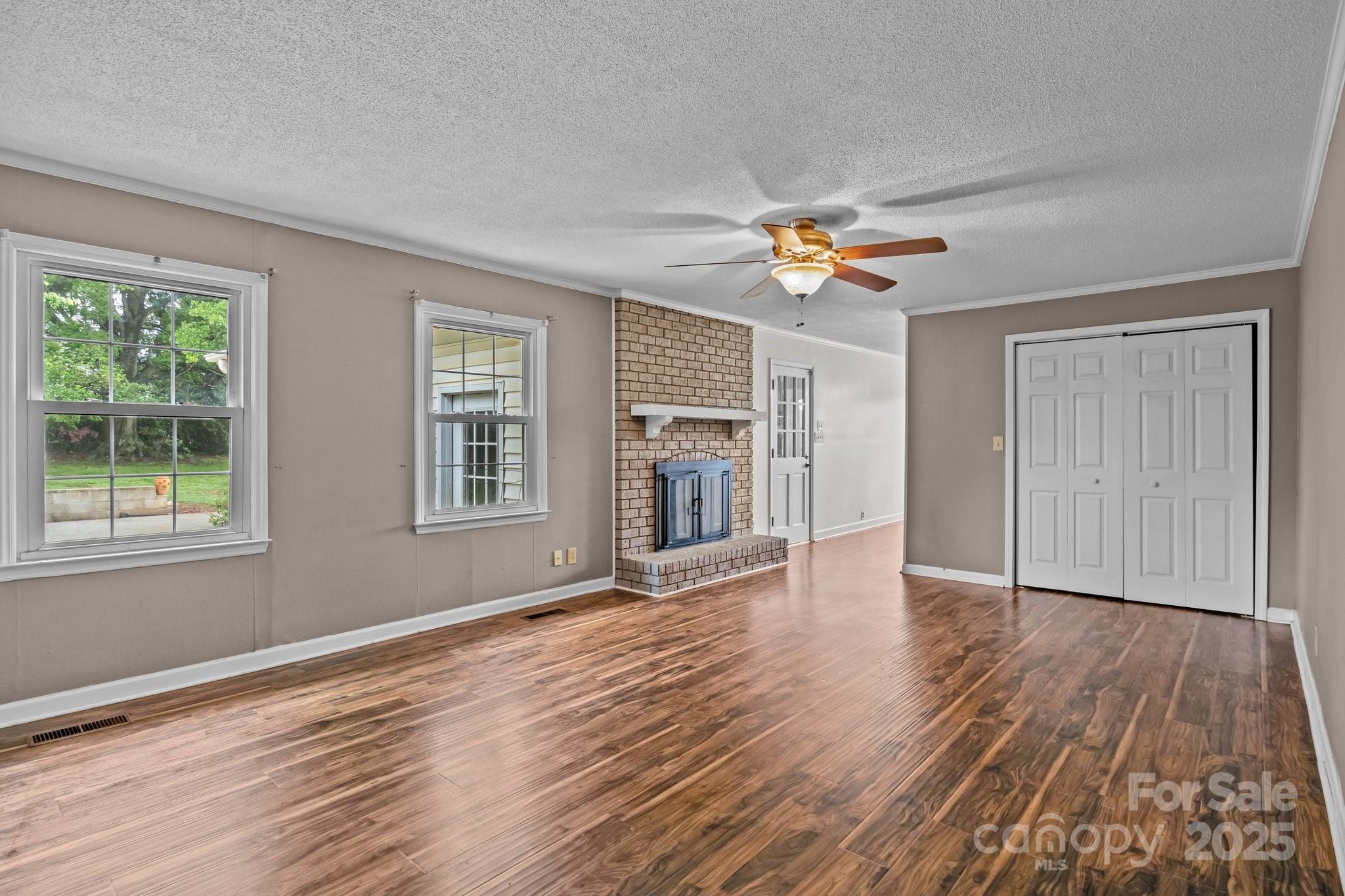 101 Wynnchester Road Gastonia, NC 28056 - Photo 17 of 46 a view of an empty room with a window and wooden floor