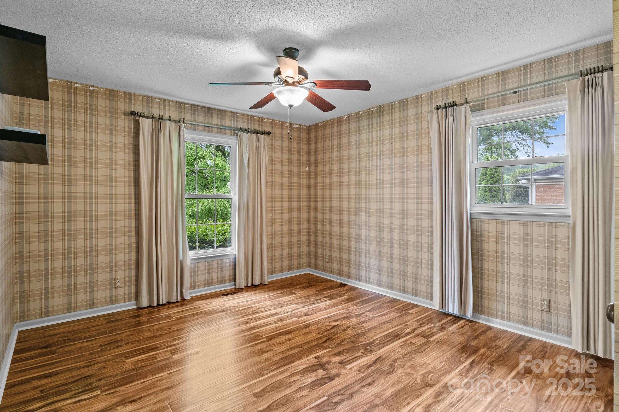 101 Wynnchester Road Gastonia, NC 28056 - Photo 22 of 46 a view of empty room with wooden floor and fan