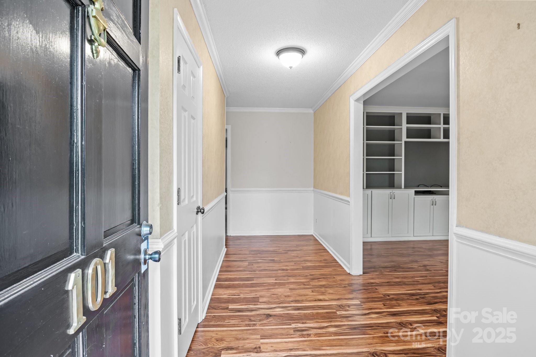 101 Wynnchester Road Gastonia, NC 28056 - Photo 3 of 46 a view of a hallway with wooden floor and staircase