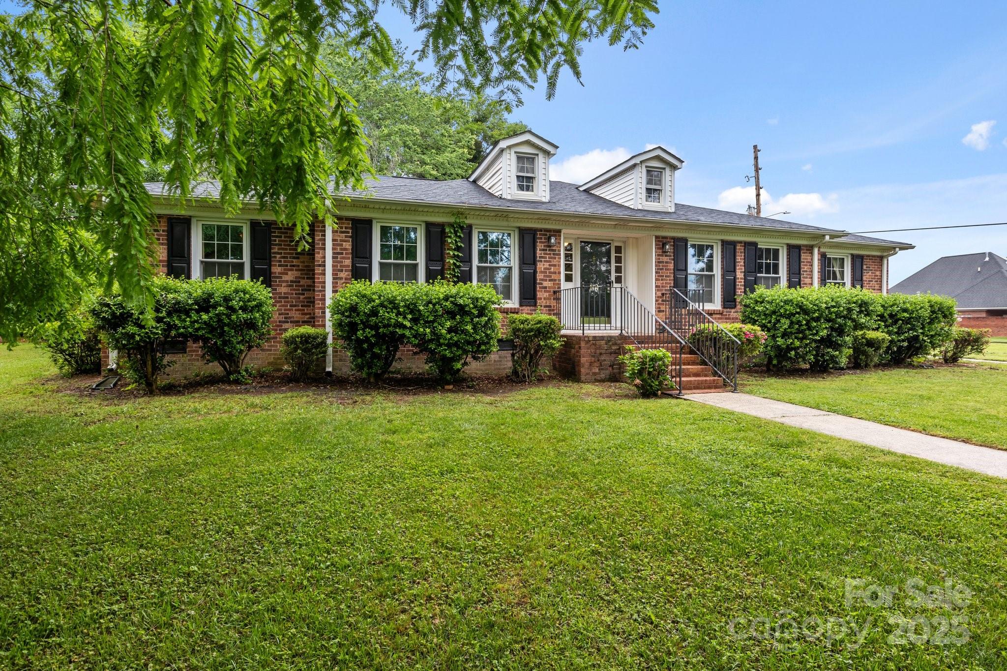 101 Wynnchester Road Gastonia, NC 28056 - Photo 31 of 46 a front view of a house with garden