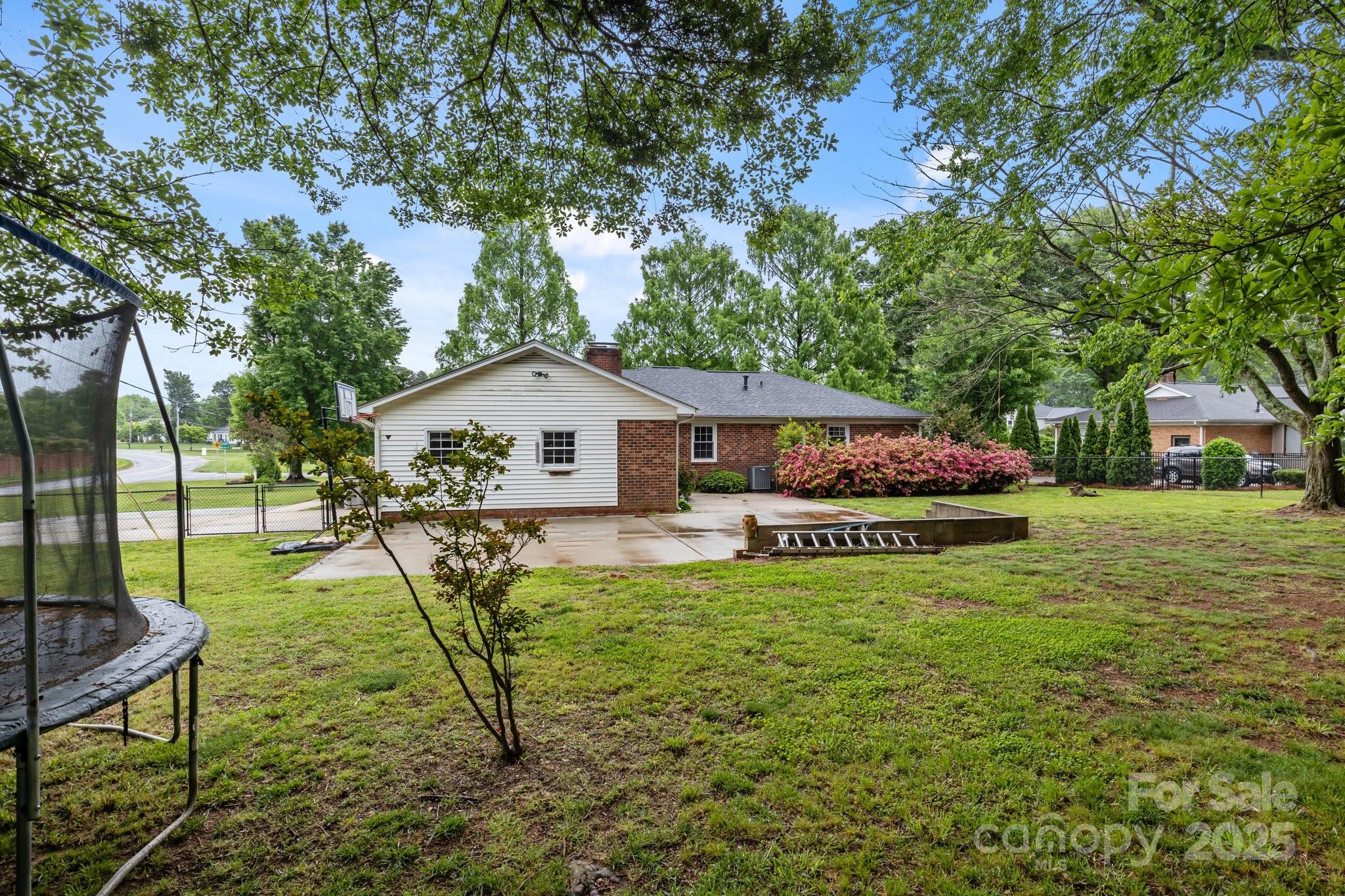 101 Wynnchester Road Gastonia, NC 28056 - Photo 40 of 46 a view of house with backyard and garden