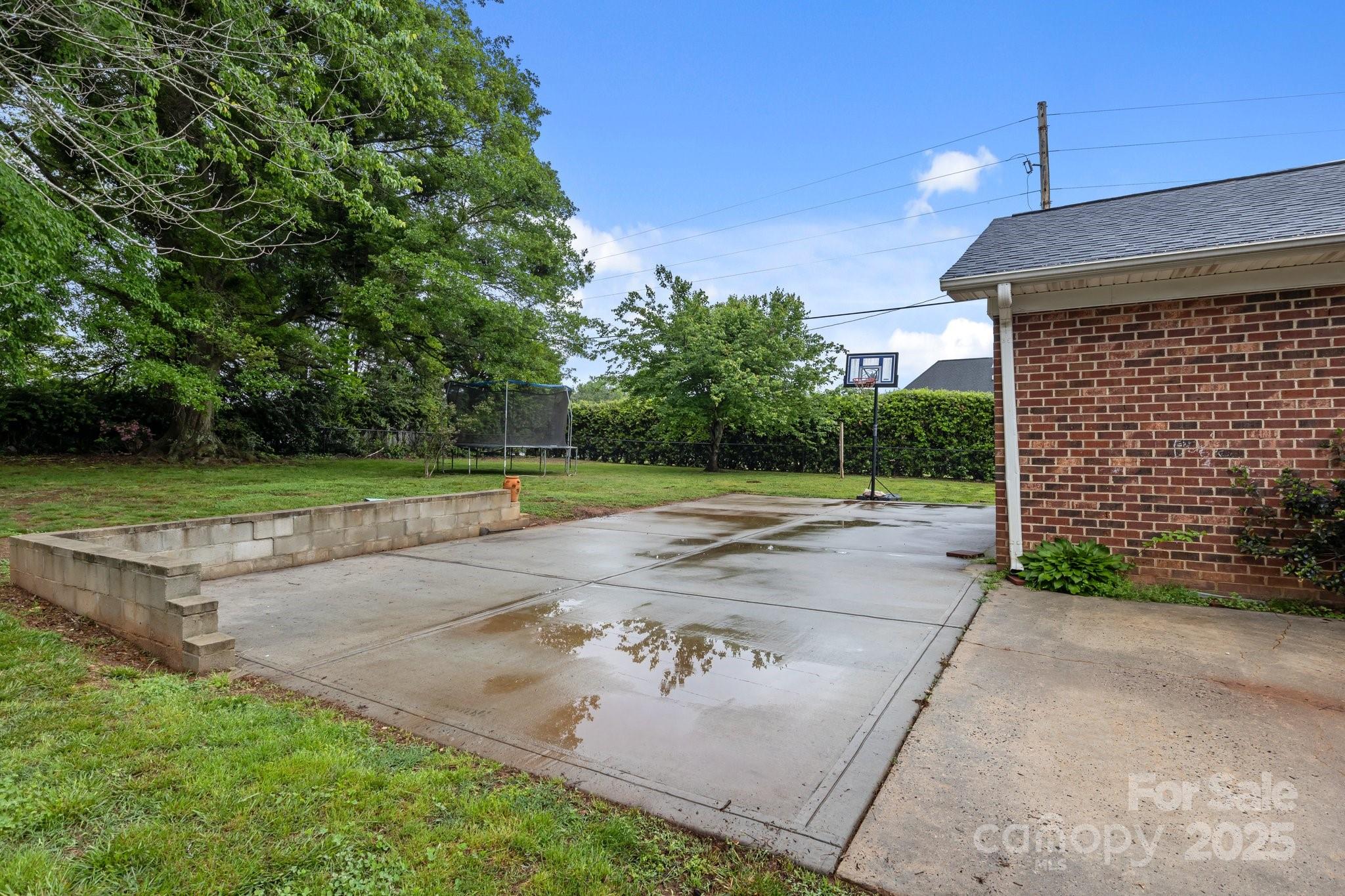 101 Wynnchester Road Gastonia, NC 28056 - Photo 41 of 46 a view of a backyard with brick wall