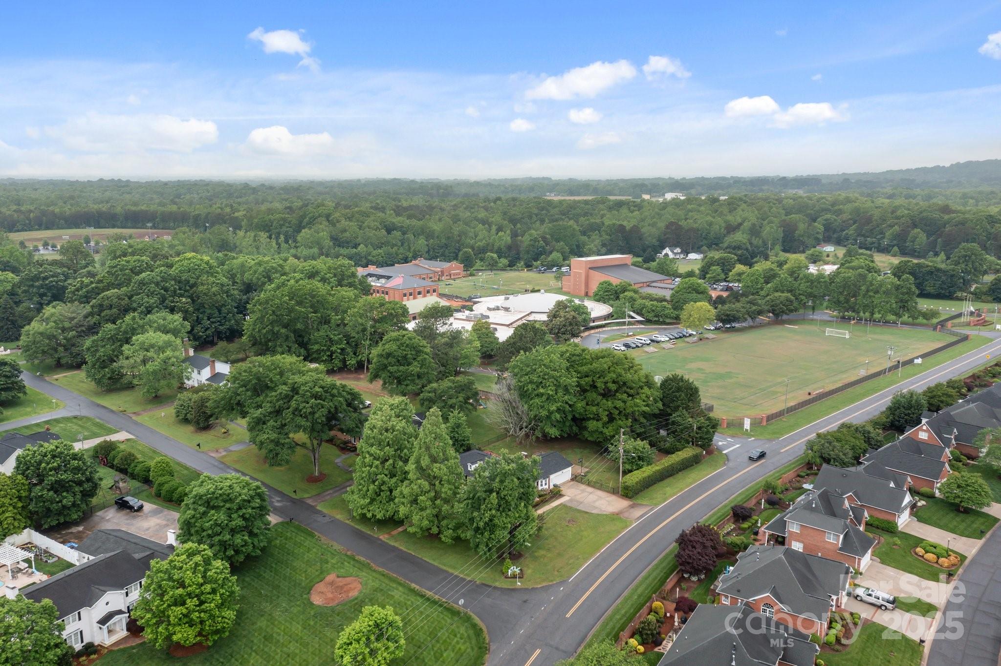 101 Wynnchester Road Gastonia, NC 28056 - Photo 45 of 46 an aerial view of city lake and trees