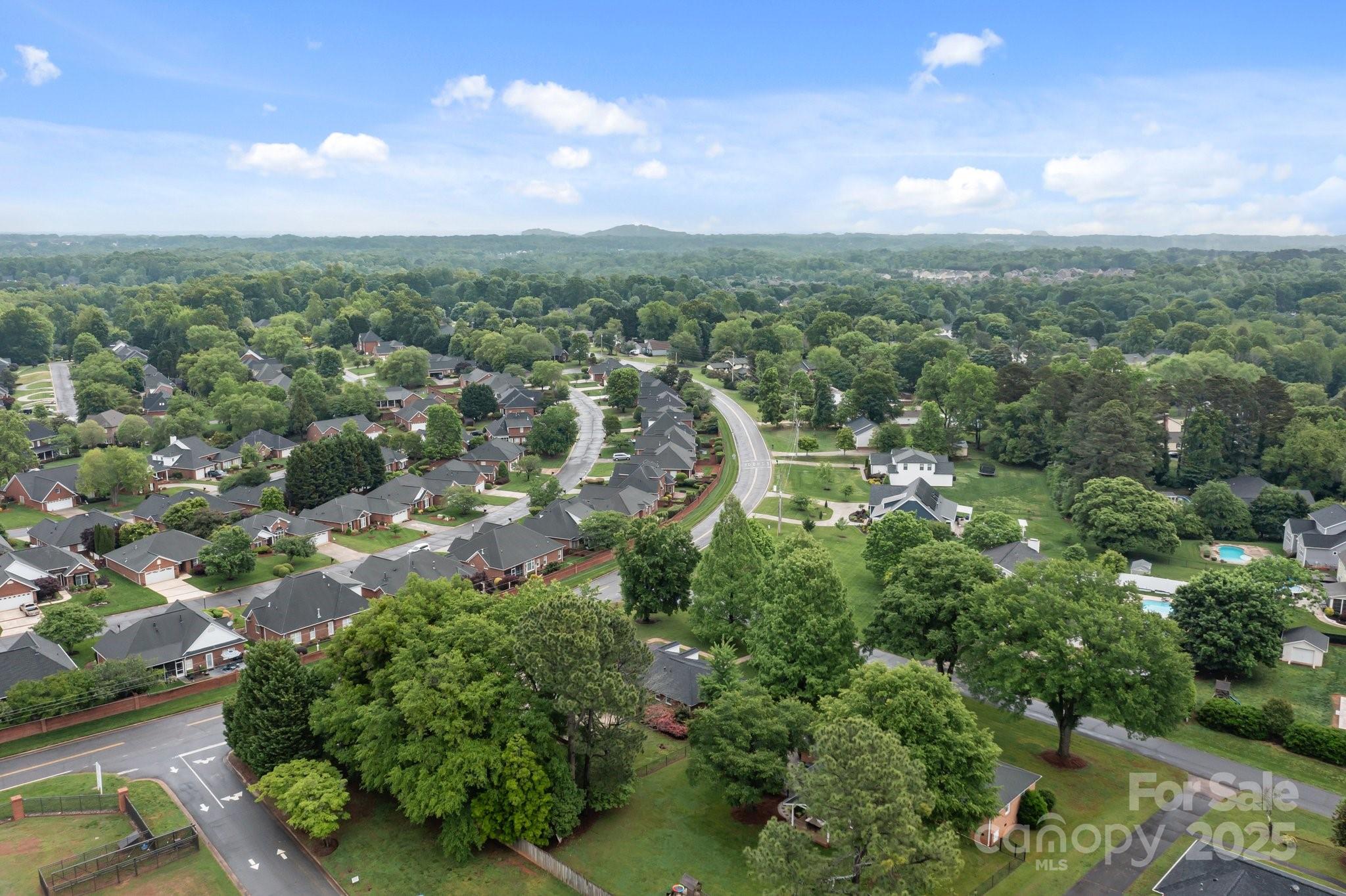 101 Wynnchester Road Gastonia, NC 28056 - Photo 46 of 46 an aerial view of residential houses with outdoor space and trees