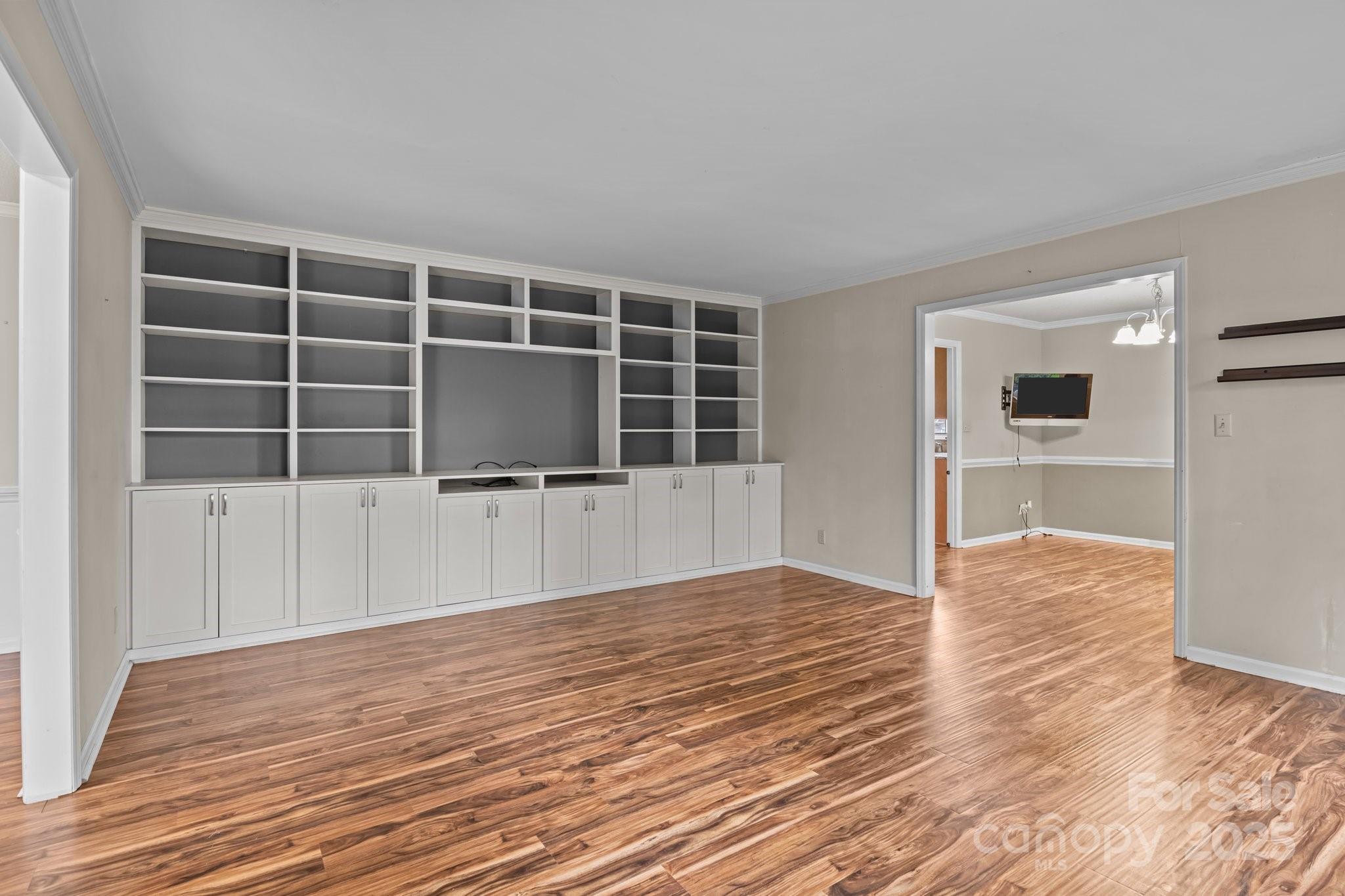 101 Wynnchester Road Gastonia, NC 28056 - Photo 5 of 46 a view of an empty room with wooden floor and windows