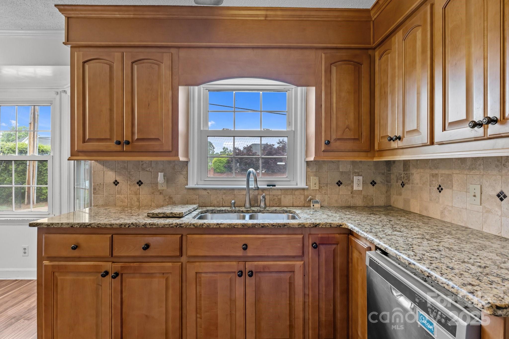 101 Wynnchester Road Gastonia, NC 28056 - Photo 10 of 46 a kitchen with granite countertop cabinets sink and window