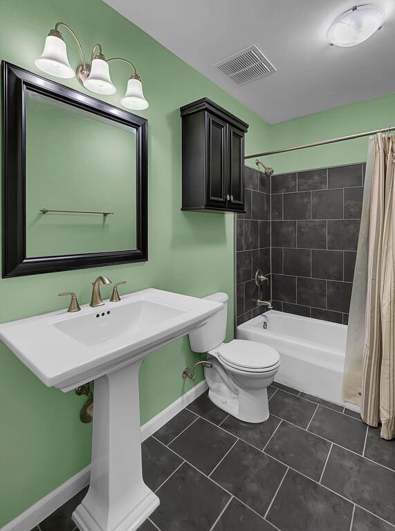 911 Fairway Road Woodway, TX 76712 - Photo 22 of 31 a bathroom with a sink toilet and shower