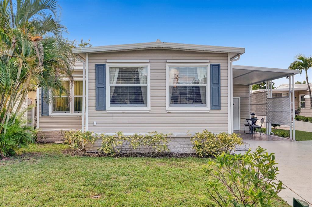 2301 Southwest 86th Terrace Davie, FL 33324 - Photo 1 of 31 a front view of a house with a garden