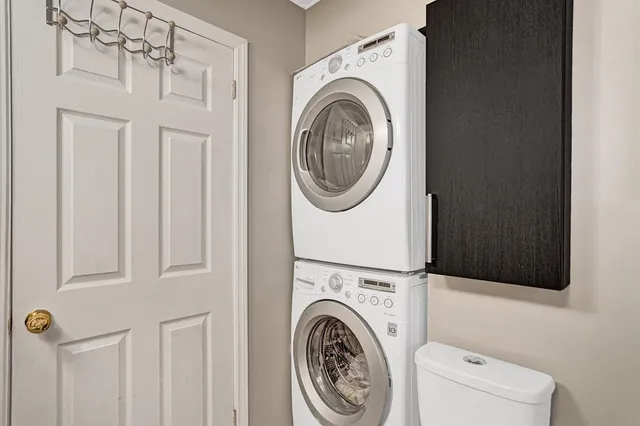 a view of a storage & utility room with dryer and washer
