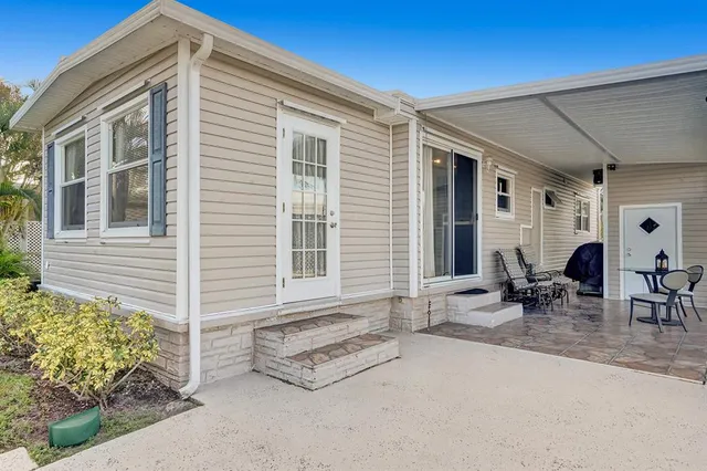 a backyard of a house with outdoor seating