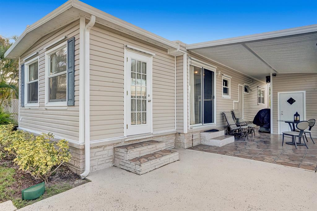 2301 Southwest 86th Terrace Davie, FL 33324 - Photo 15 of 31 a backyard of a house with outdoor seating