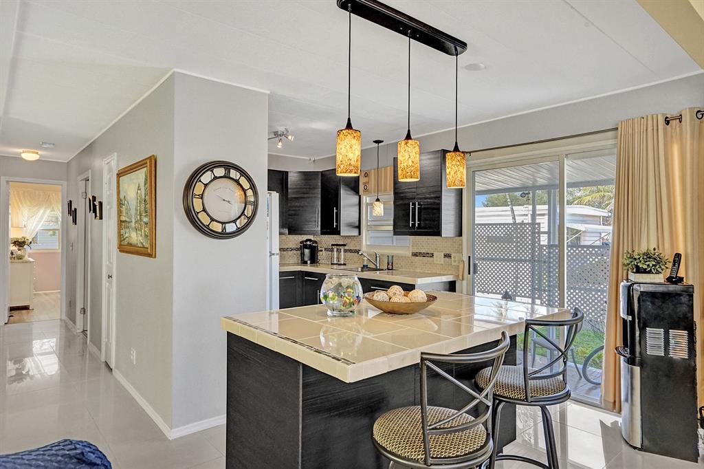 2301 Southwest 86th Terrace Davie, FL 33324 - Photo 18 of 31 a view of a dining room with furniture window and wooden floor