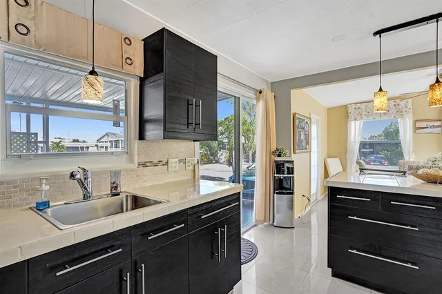 a kitchen with a sink stove and refrigerator