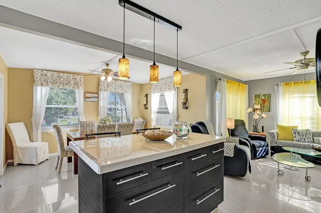 a view of living room with furniture and floor to ceiling window