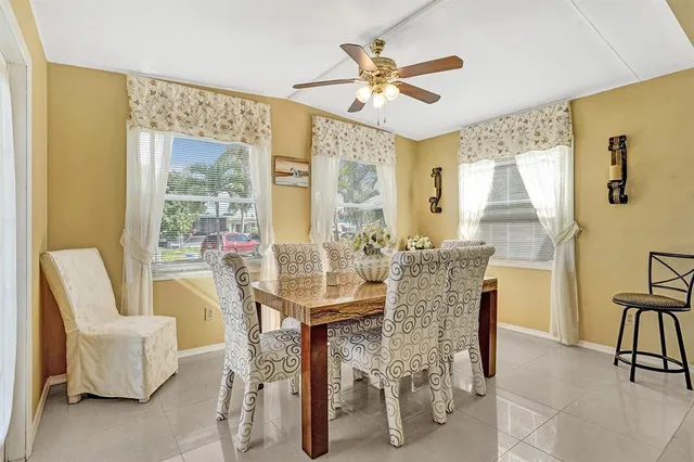 a dining room with furniture and window