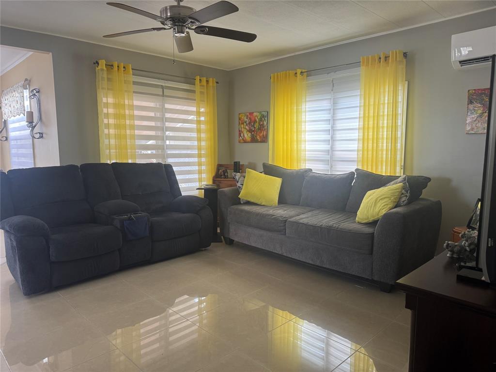 2301 Southwest 86th Terrace Davie, FL 33324 - Photo 5 of 31 a living room with furniture and a large window