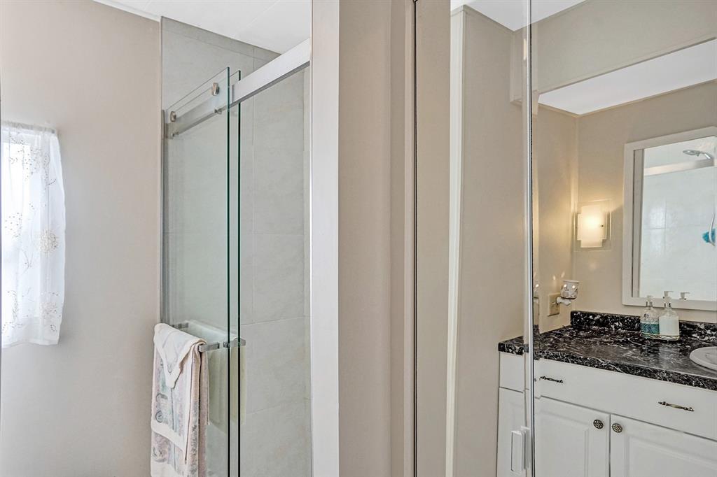 2301 Southwest 86th Terrace Davie, FL 33324 - Photo 9 of 31 a bathroom with a sink and a mirror