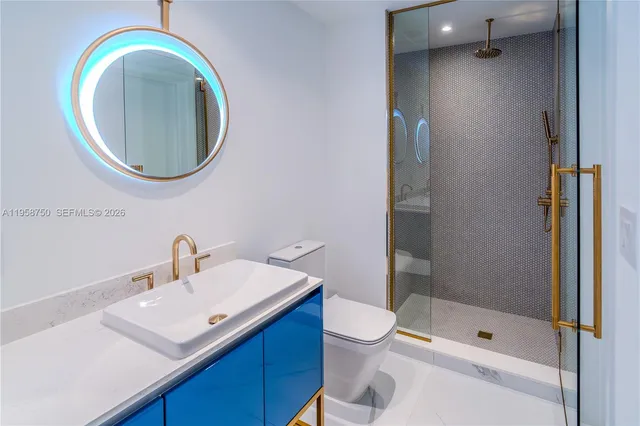 a close view of a utility room with dryer and washer