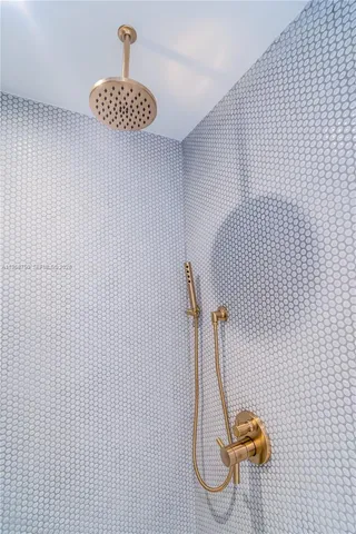 a view of a swimming pool with chairs in patio