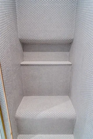 a dining room with furniture potted plants and wooden floor