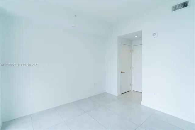 a view of an empty room and window