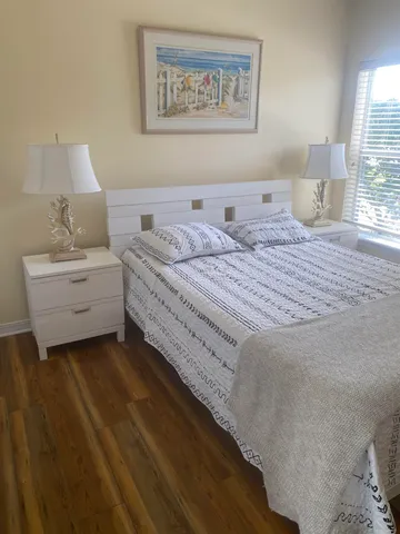 a bedroom with bed and window