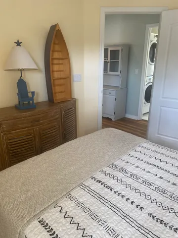 a bedroom with a bed and a dresser