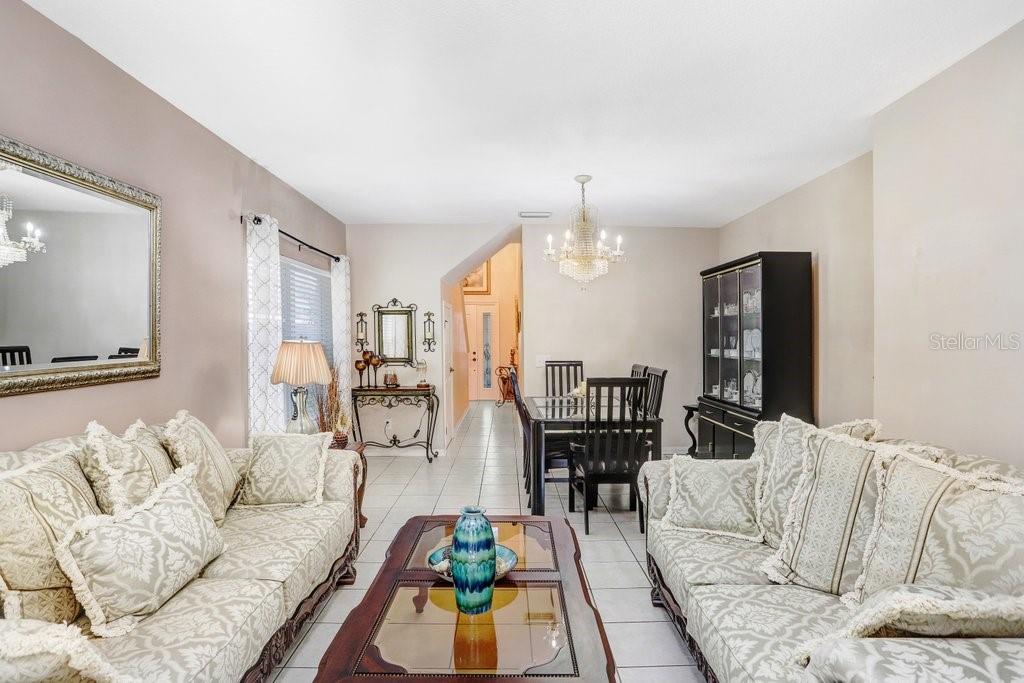 8638 Hawbuck Street Trinity, FL 34655 - Photo 13 of 43 a living room with furniture and wooden floor