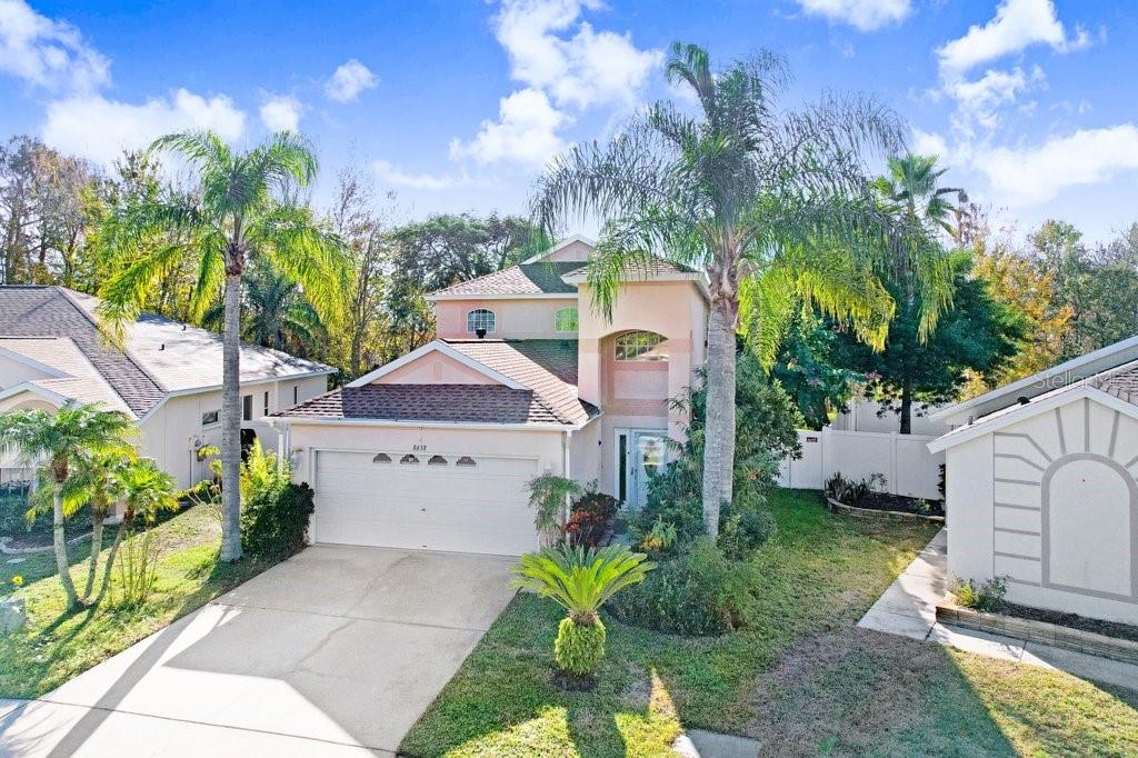 8638 Hawbuck Street Trinity, FL 34655 - Photo 2 of 43 a front view of a house with garden