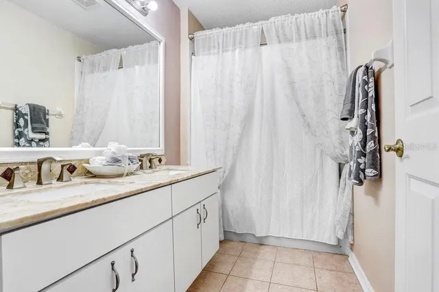 a bedroom with bed and a window