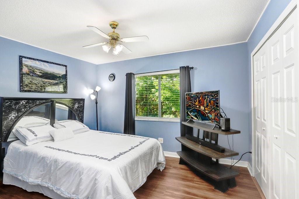 8638 Hawbuck Street Trinity, FL 34655 - Photo 29 of 43 a bedroom with a bed and a window