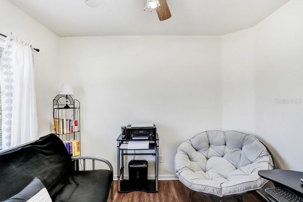 8638 Hawbuck Street Trinity, FL 34655 - Photo 32 of 43 a living room with furniture and a couch