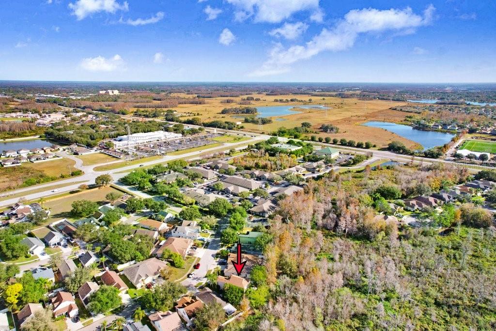 8638 Hawbuck Street Trinity, FL 34655 - Photo 7 of 43 an aerial view of residential building and city