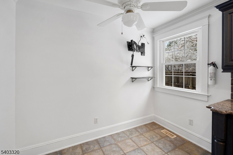 170 New Providence Road Mountainside, NJ 07092 - Photo 14 of 50 an empty room with a window and a fan