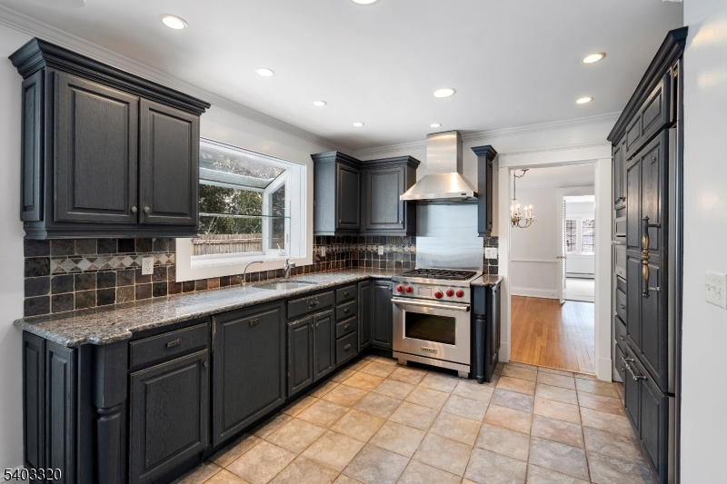 170 New Providence Road Mountainside, NJ 07092 - Photo 15 of 50 a kitchen with stainless steel appliances granite countertop a stove top oven a sink and dishwasher