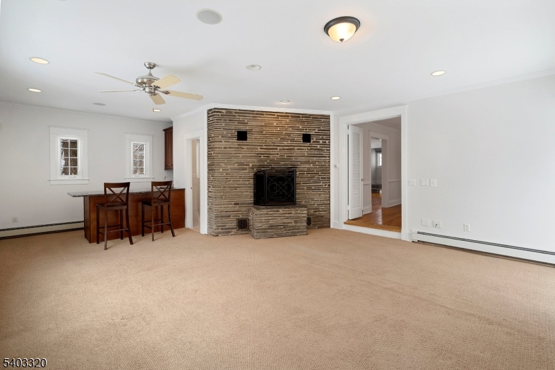 170 New Providence Road Mountainside, NJ 07092 - Photo 19 of 50 an empty room with furniture and a fireplace