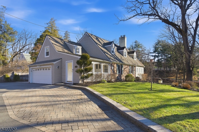 170 New Providence Road Mountainside, NJ 07092 - Photo 2 of 50 a front view of a house with a yard