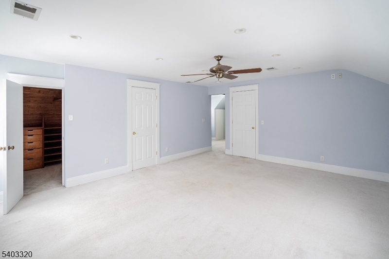 170 New Providence Road Mountainside, NJ 07092 - Photo 27 of 50 a view of an empty room with a ceiling fan