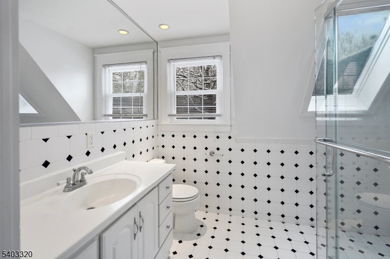 170 New Providence Road Mountainside, NJ 07092 - Photo 29 of 50 a bathroom with a sink toilet and window