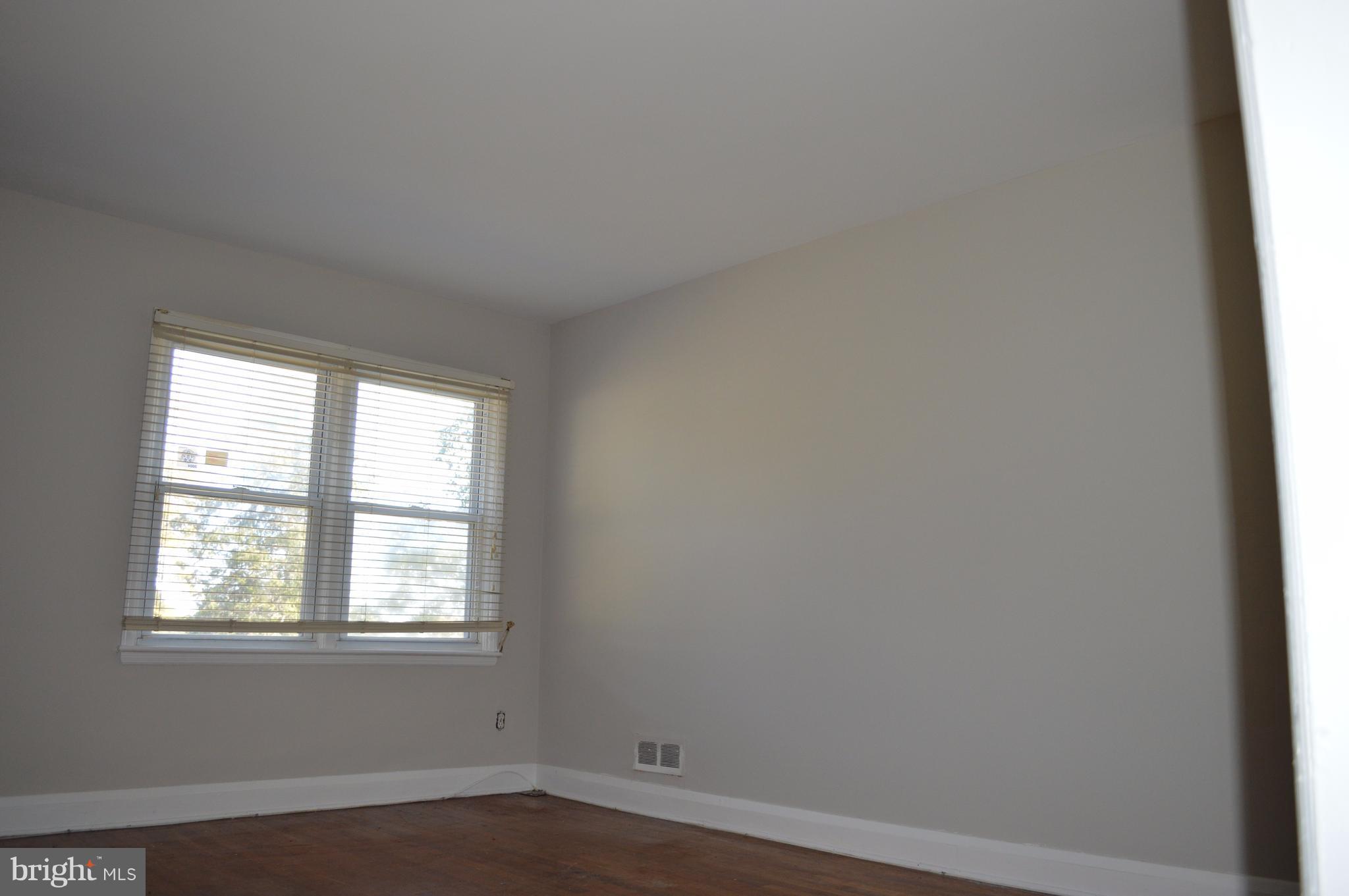 4211 Old Frederick Road Baltimore, MD 21229 - Photo 3 of 20 Living room with double window and oak floors
