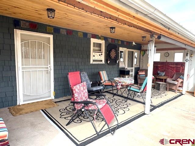 308 North Beech Street Cortez, CO 81321 - Photo 14 of 35 a living room with furniture and a window